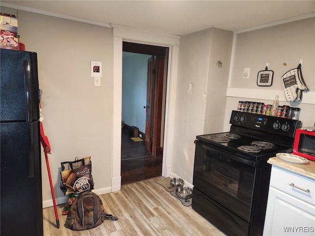158 Keil St, North Tonawanda, NY 14120 - kitchen with black appliances, light wood-type flooring, baseboards, white cabinetry, and light countertops