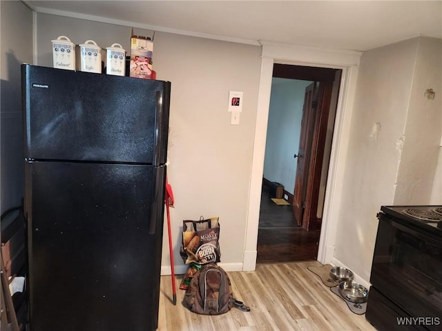 158 Keil St, North Tonawanda, NY 14120 - kitchen with black appliances, light wood-type flooring, and baseboards