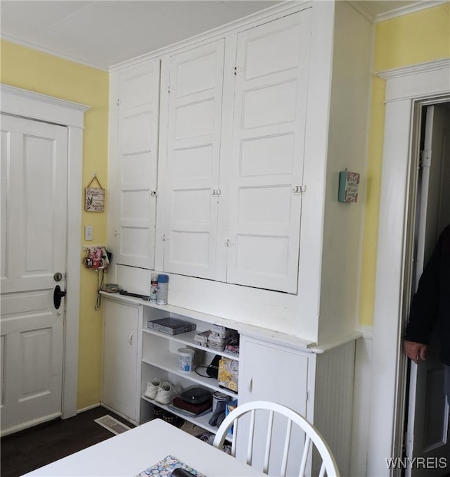 158 Keil St, North Tonawanda, NY 14120 - laundry room featuring crown molding and dark wood finished floors