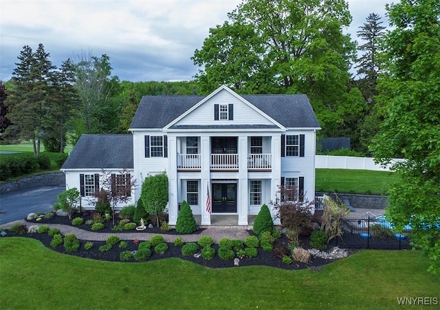 4786 Ormonde Dr, Cazenovia, NY 13035 - greek revival inspired property with a balcony, a shingled roof, and french doors