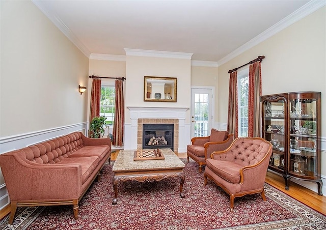 4786 Ormonde Dr, Cazenovia, NY 13035 - living area with crown molding, wood finished floors, and a tile fireplace