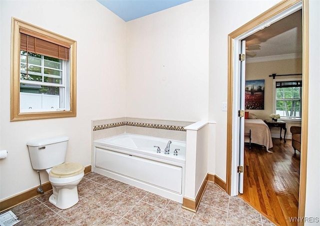 4786 Ormonde Dr, Cazenovia, NY 13035 - ensuite bathroom with a bath, baseboards, toilet, tile patterned flooring, and ornamental molding