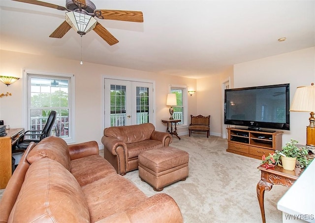 4786 Ormonde Dr, Cazenovia, NY 13035 - carpeted living area with french doors, a ceiling fan, and baseboards