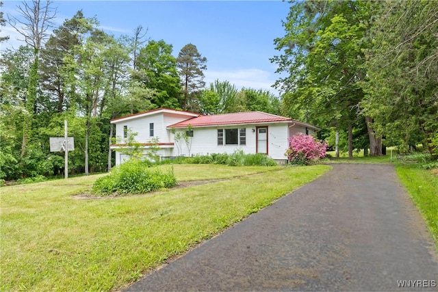 2118 Shirley Rd, North Collins, NY 14111 - tri-level home featuring driveway, a front yard, and metal roof