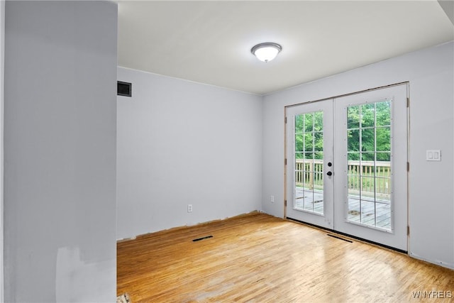2118 Shirley Rd, North Collins, NY 14111 - unfurnished room with french doors and wood finished floors