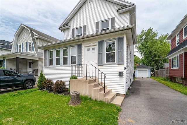 19 Mayville Ave, Tonawanda-Town, NY 14217 - view of front of property featuring a detached garage, an outbuilding, and a front lawn