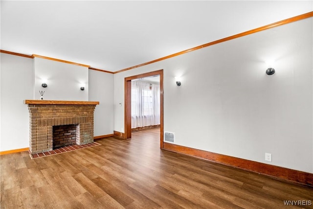 19 Mayville Ave, Tonawanda-Town, NY 14217 - unfurnished living room with wood finished floors, baseboards, crown molding, and a fireplace