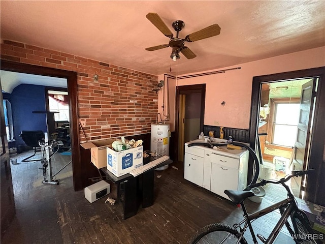 360 Watson St, Buffalo, NY 14212 - dining area with water heater, dark wood-style floors, brick wall, and a ceiling fan