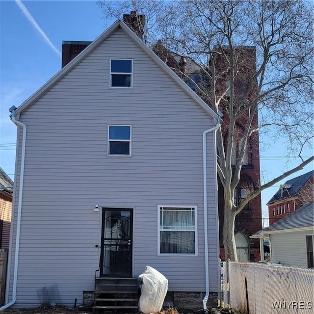 360 Watson St, Buffalo, NY 14212 - rear view of house featuring a chimney and entry steps
