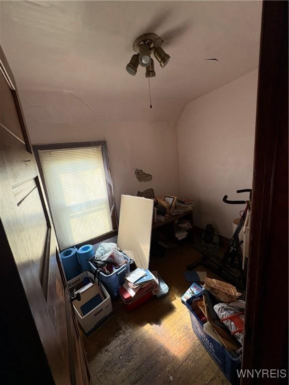 360 Watson St, Buffalo, NY 14212 - unfurnished bedroom featuring wood finished floors, vaulted ceiling, and a ceiling fan