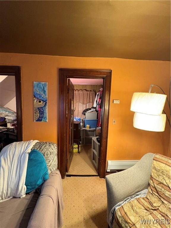 360 Watson St, Buffalo, NY 14212 - bedroom with light carpet, a baseboard heating unit, a closet, and a spacious closet