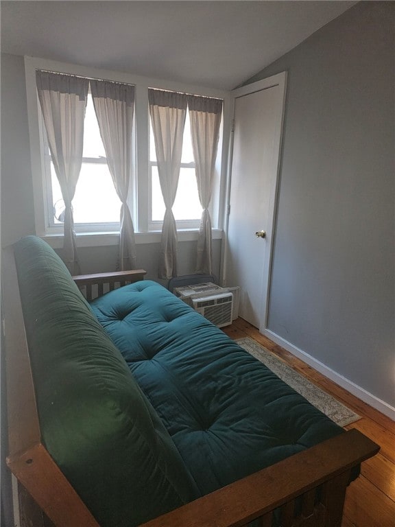 2968 County Highway 11, Hartwick, NY 13348 - bedroom featuring wood finished floors, vaulted ceiling, and baseboards