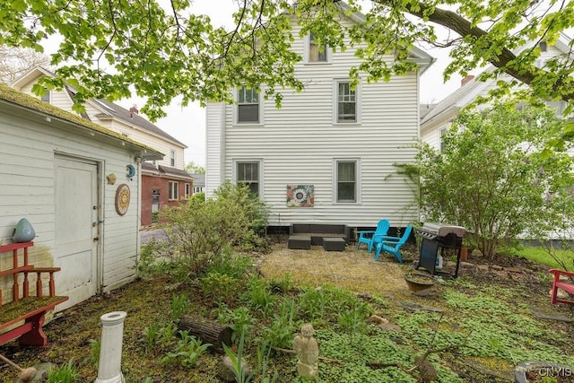 173 Mosley Dr Unit 1, Syracuse, NY 13206 - back of property featuring an outdoor living space and a patio