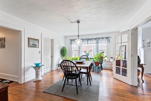 173 Mosley Dr Unit 1, Syracuse, NY 13206 - dining room with wood finished floors and baseboards