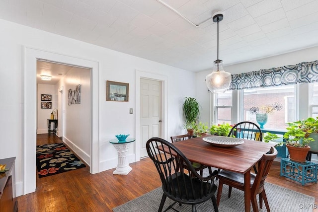 173 Mosley Dr Unit 1, Syracuse, NY 13206 - dining space with dark wood finished floors and baseboards