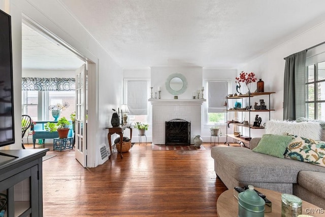173 Mosley Dr Unit 1, Syracuse, NY 13206 - living area featuring wood finished floors and a fireplace
