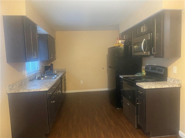 6 Gemini Cir, Gates, NY 14606 - kitchen featuring black electric range oven, stainless steel microwave, a sink, and dark wood-style floors