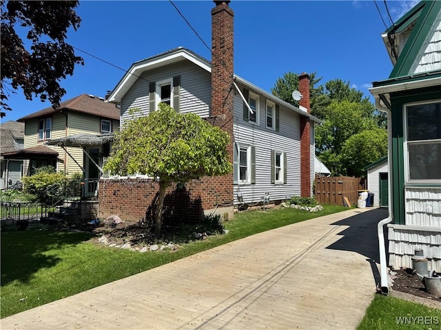 52 S New York St, Lockport-City, NY 14094 - view of side of home with a chimney