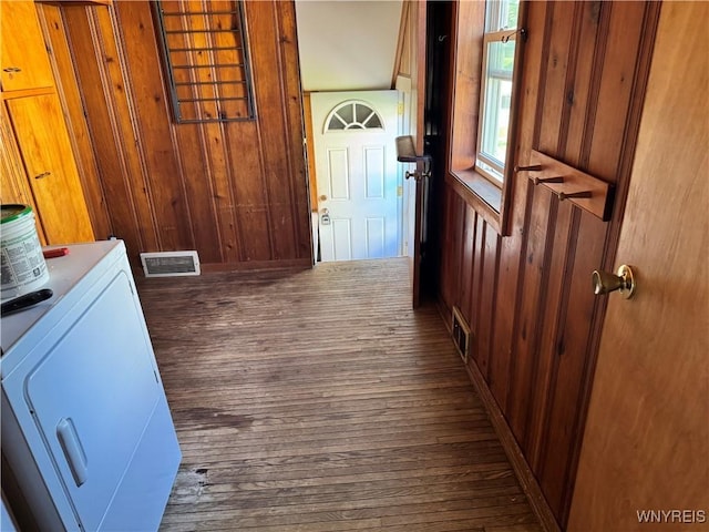 52 S New York St, Lockport-City, NY 14094 - hallway featuring dark wood-style flooring, wood walls, and washer / dryer
