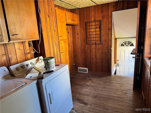 52 S New York St, Lockport-City, NY 14094 - laundry area with washing machine and dryer, cabinet space, wooden walls, and dark wood-style flooring