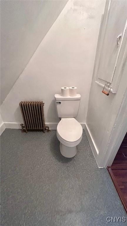707 Broadway, Rome-Inside, NY 13440 - bathroom featuring radiator heating unit, baseboards, and toilet