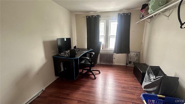 707 Broadway, Rome-Inside, NY 13440 - office area with radiator heating unit, wood finished floors, and baseboards