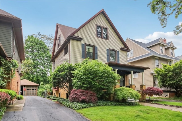865 Harvard St, Rochester, NY 14610 - view of front of property featuring a garage and a front yard