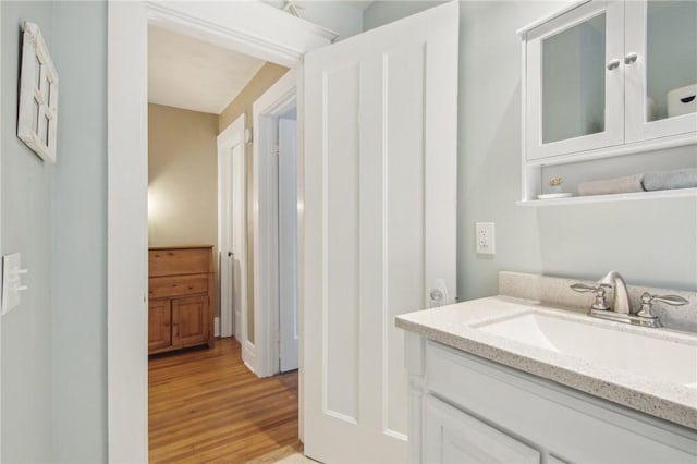 865 Harvard St, Rochester, NY 14610 - bathroom featuring wood finished floors and vanity