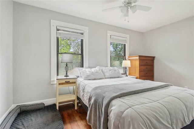 865 Harvard St, Rochester, NY 14610 - bedroom featuring wood finished floors, multiple windows, baseboards, and ceiling fan
