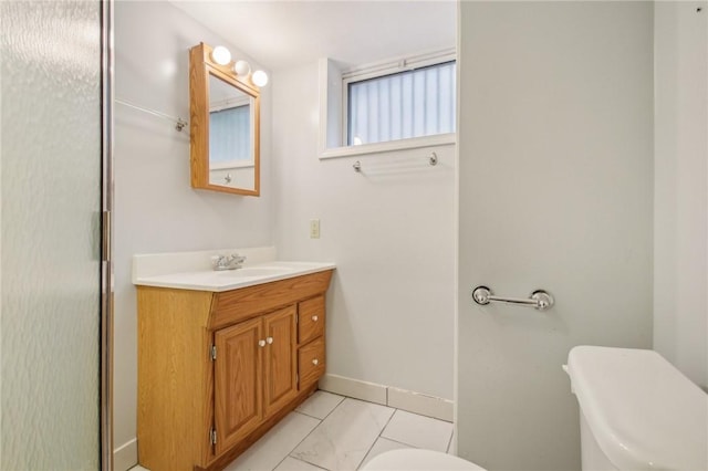 865 Harvard St, Rochester, NY 14610 - bathroom featuring toilet, vanity, baseboards, and tile patterned flooring