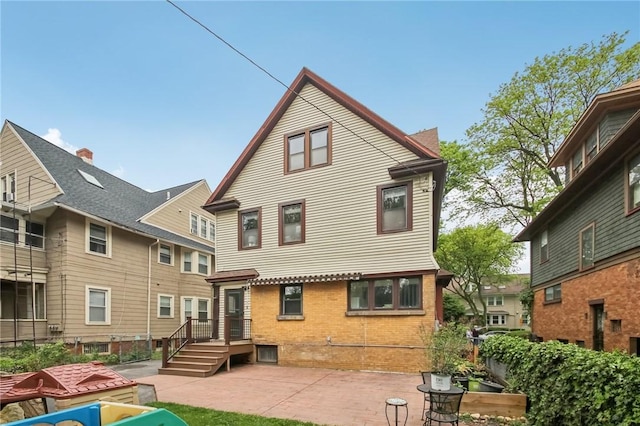 865 Harvard St, Rochester, NY 14610 - back of property featuring a patio and brick siding