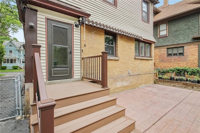865 Harvard St, Rochester, NY 14610 - entrance to property with brick siding and a patio
