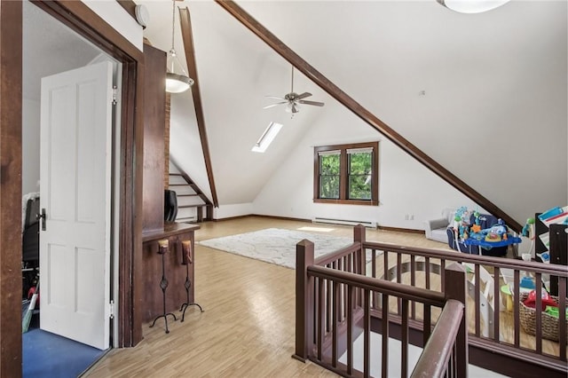 865 Harvard St, Rochester, NY 14610 - bonus room featuring light wood finished floors, a baseboard radiator, a ceiling fan, and lofted ceiling
