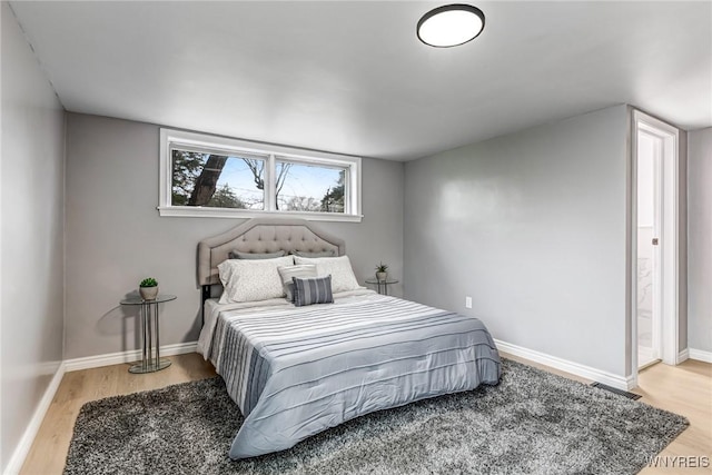 296 Burke Dr, Cheektowaga, NY 14215 - bedroom featuring wood finished floors and baseboards