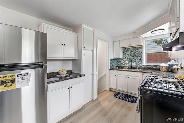 296 Burke Dr, Cheektowaga, NY 14215 - kitchen with freestanding refrigerator, white cabinets, gas range oven, and light wood-style flooring