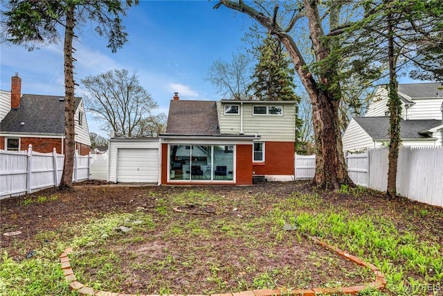 296 Burke Dr, Cheektowaga, NY 14215 - back of property with brick siding, a fenced backyard, and a chimney