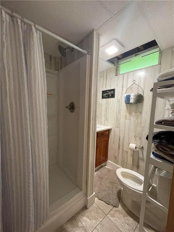 120 Fisher Ln, Afton, NY 13730 - bathroom with a shower stall, wood walls, toilet, vanity, and tile patterned floors
