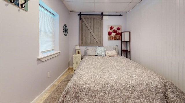 120 Fisher Ln, Afton, NY 13730 - bedroom featuring a barn door and baseboards