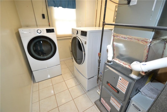2314 Vandy Dr, Macedon, NY 14522 - washroom with separate washer and dryer, light tile patterned floors, and baseboards