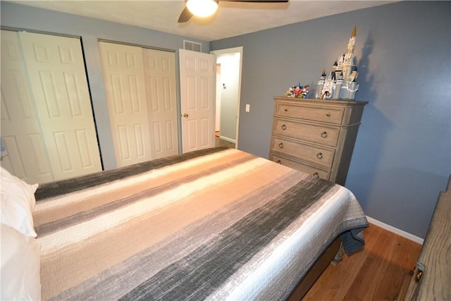 2314 Vandy Dr, Macedon, NY 14522 - bedroom with wood finished floors, baseboards, multiple closets, and ceiling fan