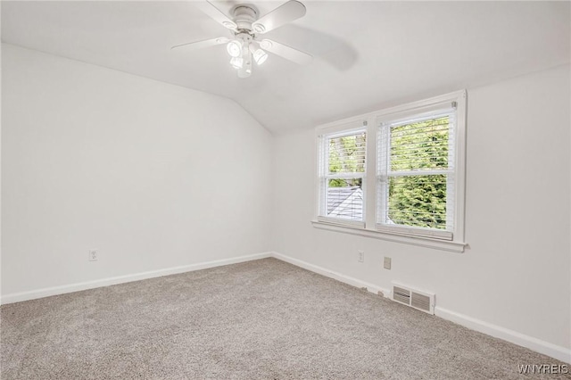 370 Mount Vernon Rd, Amherst, NY 14226 - carpeted empty room featuring vaulted ceiling, ceiling fan, and baseboards