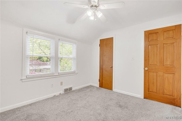 370 Mount Vernon Rd, Amherst, NY 14226 - unfurnished bedroom with lofted ceiling, carpet floors, baseboards, and a ceiling fan