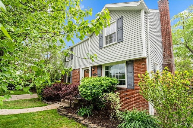 370 Mount Vernon Rd, Amherst, NY 14226 - view of front of house with brick siding and a chimney