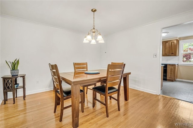370 Mount Vernon Rd, Amherst, NY 14226 - dining area featuring a chandelier, light wood-type flooring, crown molding, and baseboards