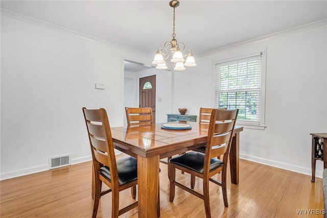 370 Mount Vernon Rd, Amherst, NY 14226 - dining room featuring ornamental molding, a chandelier, light wood-style flooring, and baseboards
