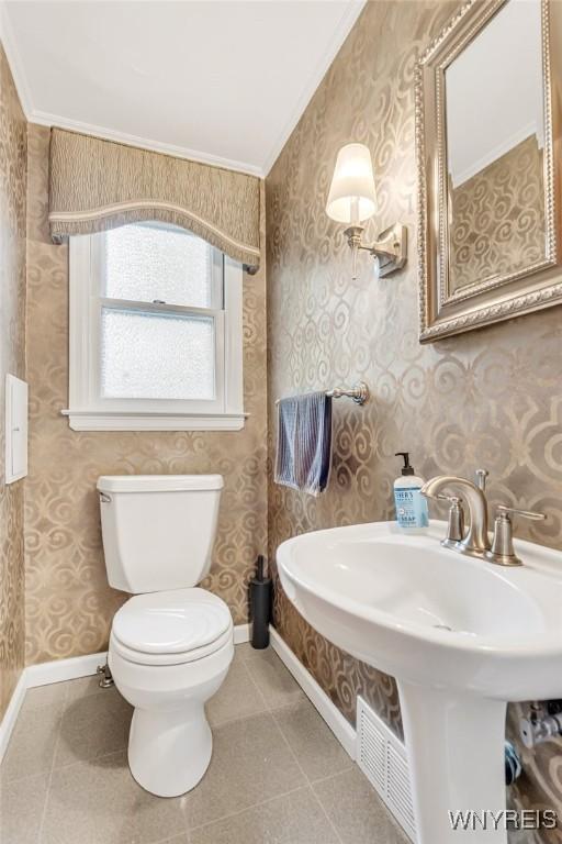 370 Mount Vernon Rd, Amherst, NY 14226 - half bathroom with ornamental molding, toilet, tile patterned flooring, baseboards, and wallpapered walls