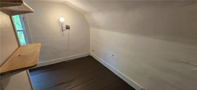 12034 Washington St, Wolcott, NY 14590 - additional living space featuring vaulted ceiling, dark wood finished floors, and baseboards