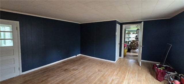 12034 Washington St, Wolcott, NY 14590 - unfurnished room featuring wood finished floors, baseboards, and ornamental molding