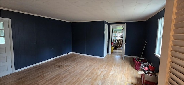 12034 Washington St, Wolcott, NY 14590 - spare room featuring hardwood / wood-style floors, ornamental molding, and baseboards