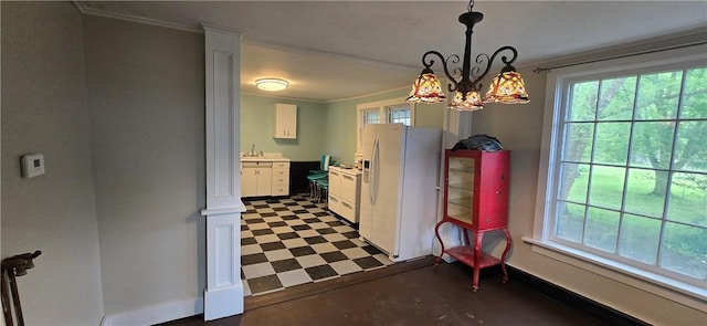 12034 Washington St, Wolcott, NY 14590 - dining room with dark floors, crown molding, a chandelier, and baseboards